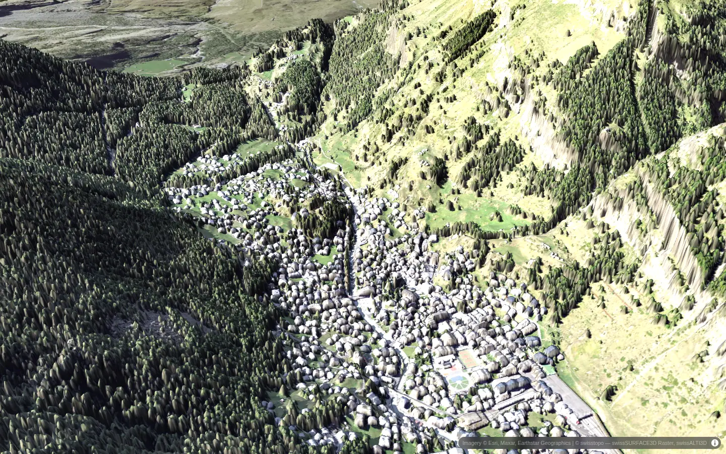Zermatt in 3D: the village in the valley floor between steep forested slopes, in morning sun